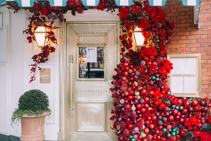 baubles, christmas floral design, christmas in london, christmas lights, creative floral installations, creative london florist, doorways, Early Hours London, iconic stores in london, kings road, london christmas, london facades, London florist, london flowers, places to visit in london, pretty little london, shop windows, showdry, Store Fronts, harry's dolce vita, top london restaurant, red flowers 