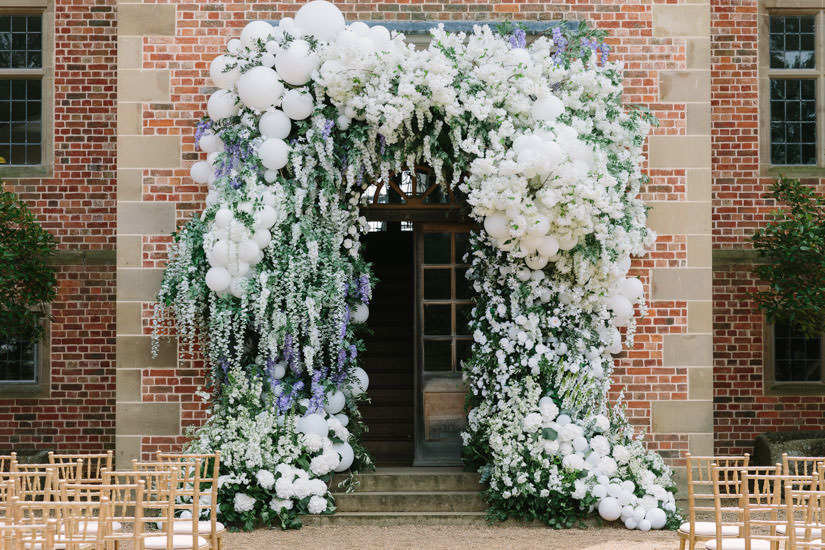 ballon arch, barker evans photography, celebrity wedding, early hours ltd, english wedding, floral and balloon arch, floral arch, florist at work, halfpenny wedding dress, hello magazine, hugo taylor, london florist, luxury florist, Luxury wedding, made in chelsea, millie and Hugo wedding, Millie Mackintosh, peonies, pink blossom, pink wedding decor, savile rose, stylish wedding dress, surrey wedding, tablescape, wedding flower inspiration, wedding flowers, wehite wedding decor, white wedding